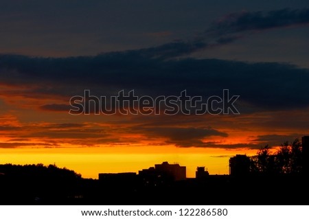 City view on sunset, buildings silhouettes in colourful sunset, evening in the city, dramatic colourful sunset sky in the city with buildings silhouettes, sunset vin Vilnius