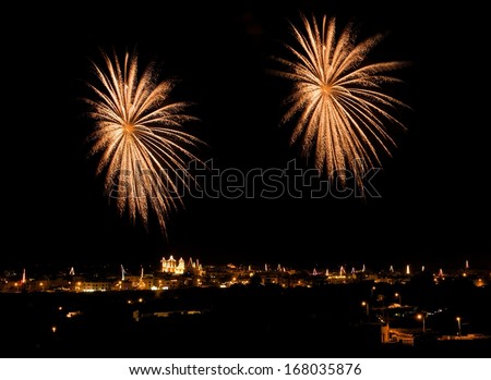 Fireworks,colorful fireworks background,fireworks explosion in dark sky with village silhoutte in Qrendi,Malta, fireworks in Malta, long exposure fireworks,Independence day, fireworks festival,explode