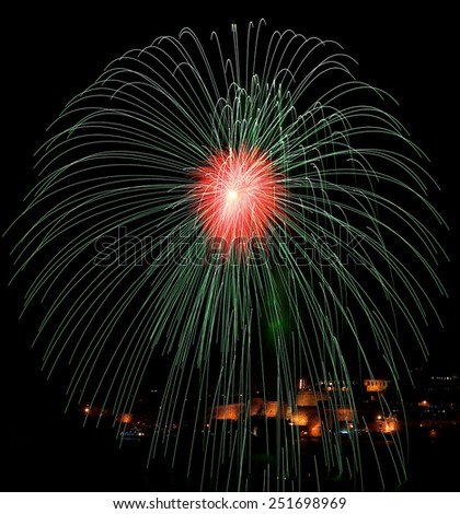 Green red fireworks isolated in dark background with the place for text and Valletta city on the bottom, Malta fireworks festival, 4 of July, Independence day, New Year, explode, fireworks festival