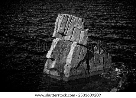 Similar – Foto Bild Felsen, der unter Wolkenverhangenem Himmel mickrig klein wirkt.