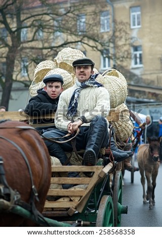 VILNIUS, LITHUANIA-MARCH 7: Unidentified peoples parade in annual traditional crafts fair - Kaziuko fair on Mar 7, 2015 in Vilnius, Lithuania.People in old traditional costumes and hand crafts