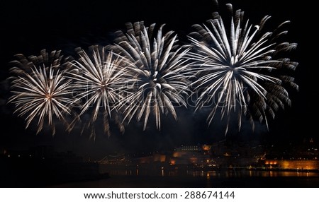 Amazing fireworks explode in Malta in dark sky,Malta fireworks festival, 4 of July, Independence day, fireworks explode, New Year, fireworks in Valletta isolated in dark background with place for text