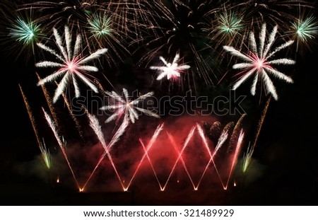 Fireworks explosion close up in dark background, Fireworks background. Holidays.Fireworks festival.Light show.Explosion. Fireworks in Lithuania.4 July, New Year, maltese.Fireworks festival in Vilnius