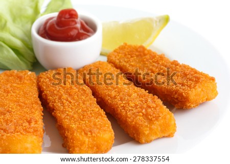 Golden fried fish fingers with lemon and tomato sauce.