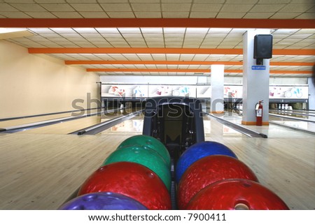 bowling balls with bowling lanes as background
