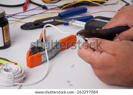 A bunch of tools used for soldering wires.