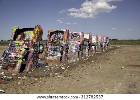 Graffiti cover cars at Cadillac Ranch in Amarillo, Texas on July 13, 2015.