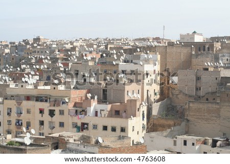Contrasts of ancient city Fez, Morocco, Africa - roofs of old houses with new satelites.