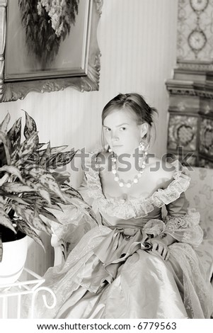 Girl with baroque style ancient dress, palnt and paintings