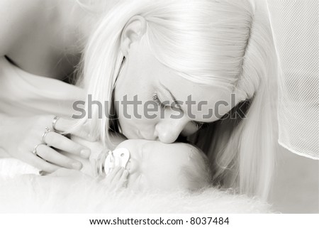 White family - mother takes care about angel like child