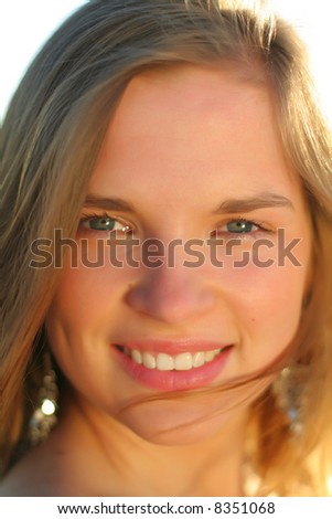 Beautiful self-confident nice teenage girl with perfect make-up and cosmetic