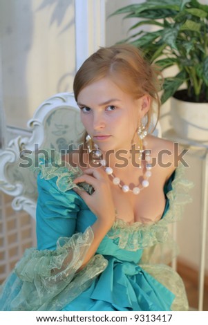 Aristocratic girl in fancy dress  right before ball