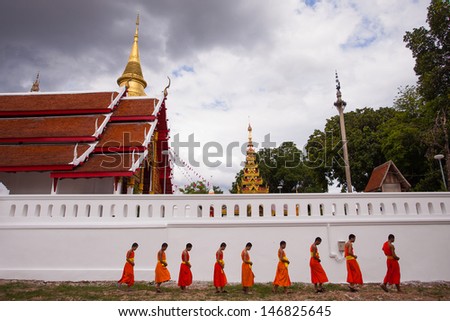 LAMPANG,THAILAND-JULY 21,13:Many monks of Thailand assembled religious rituals homage to the Buddha in the Day before the Buddhist Lent at the Wat Phra That Lampang Laow,July 21,2013 in Thailand