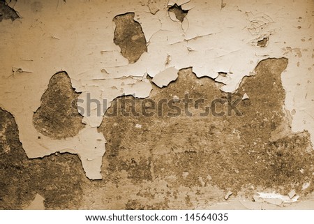 Texture of an old concrete wall with torn flakes of paint