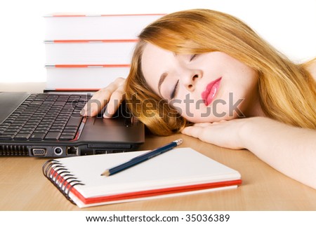 Young woman sleeping at her workplace