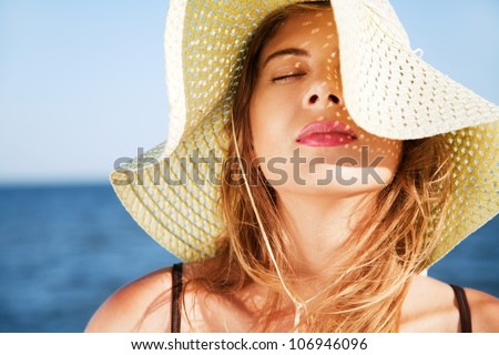 Beautiful woman on a beach on a sunny day