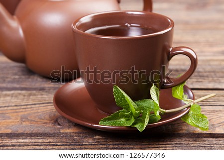 Tea with mint on a wooden table - studio still life