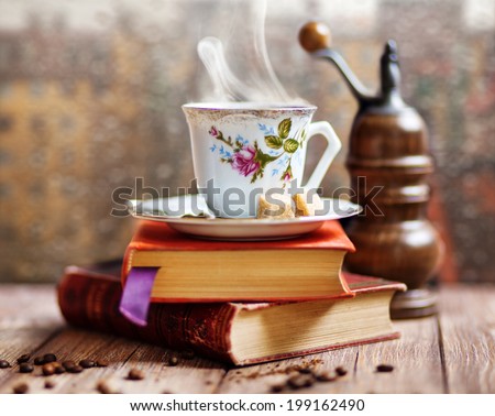 Steaming coffee cup on a rainy day window background