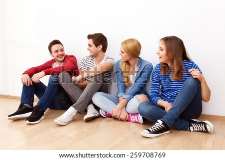 Group of four young people indoors