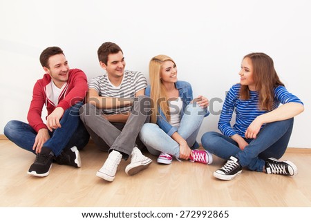 Group of four young people indoors