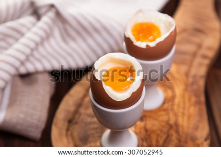 Boiled eggs on a wooden background.