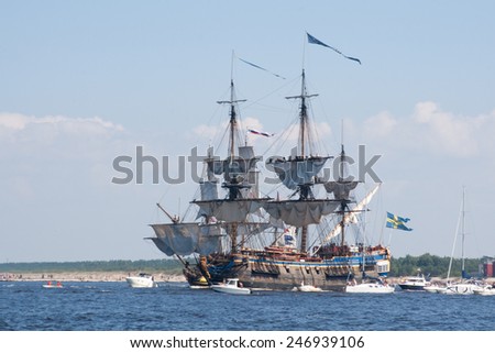 RIGA, LATVIA - JULY 29: Regatta The Tall Ships Races 2013. Sailing ships are leaving the river Daugava and come to the Baltic sea.