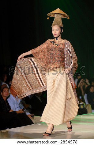 Fashion model in contemporary dress during KL fashion week