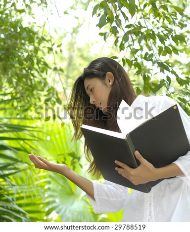 A pretty college girl study on leaves for bio technology
