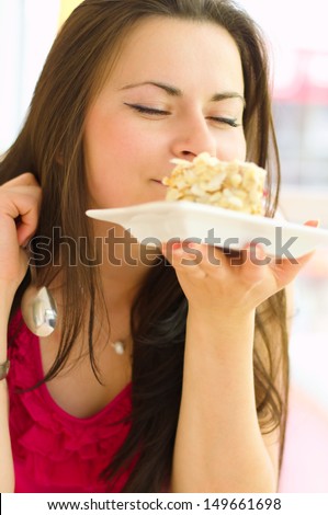 Young beautiful woman with cake