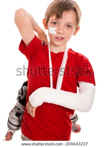 portrait of boy with a broken arm holding roller skates, isolated over white