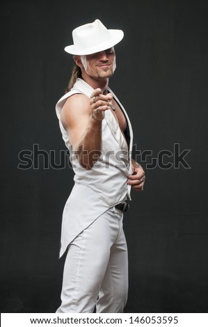 Male dancer dressed in white suite