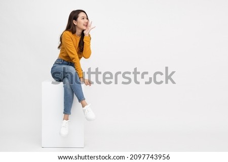 Similar – Image, Stock Photo woman sitting on a purple sofa and painting her lips red