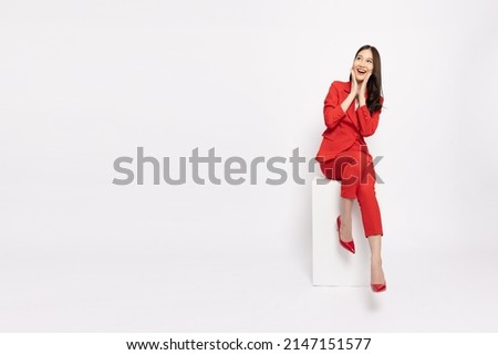 Similar – Image, Stock Photo Woman sitting on red suitcase on road