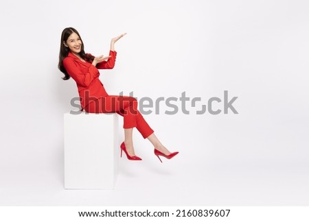 Similar – Image, Stock Photo Woman sitting on red suitcase on road