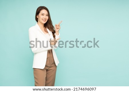 Similar – Image, Stock Photo Beautiful young confident Asian young girl posing  in front of colorful wall. Female tourist from China traveling in Europe. Exchange student. Fashion and style concept with Asian model.