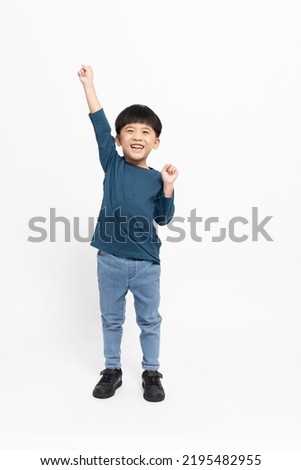 Similar – Image, Stock Photo Cute little boy celebrating of July, 4 Independence Day of USA at sunny summer sunset. Happy child running and jumping with american flag symbol of United States over wheat field.