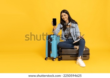 Image, Stock Photo Female traveler sitting on rock and enjoying landscape