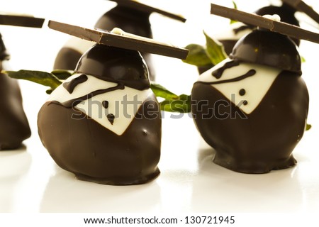 Gourmet chocolate covered strawberries decorated for graduation party.