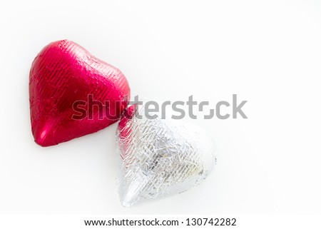 Heart shape chocolate candies wrapped in colorful foil for Valentine\'s Day.