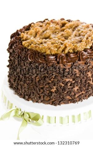 German chocolate cake with two layers of chocolate cake filled and topped with classic German chocolate filling (a caramel-goo of coconut and pecans), covered in chocolate buttercream.