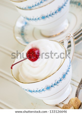 Cup of cheesecake frozen yogurt or soft serve ice cream.