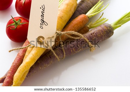 Organic rainbow carrots and tomatoes from the local farm.