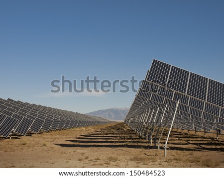 A series of large solar panels forms a symmetrical line at a power plant in the San Luis Valley of central Colorado.