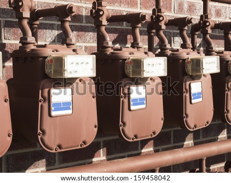 Water meters on the wall of apartment building.
