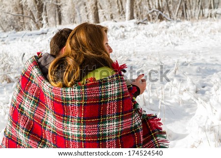https://image.shutterstock.com/display_pic_with_logo/1059122/174524540/stock-photo-young-couple-at-the-picnic-on-the-valentines-day-in-a-snowy-park-174524540.jpg