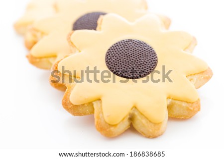 Easter sugar cookies in shape of flower with chocolate icing.