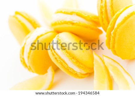 Gourmet small colorful French macarons with lemon flavor.