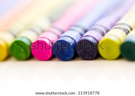 Multicolored crayons on a white background.