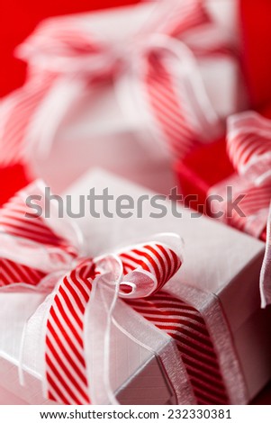 Red and white boxes with Christmas gifts.