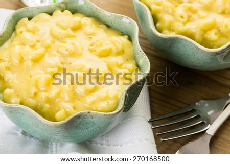 Preparing macaroni and cheese with elbow macaroni.